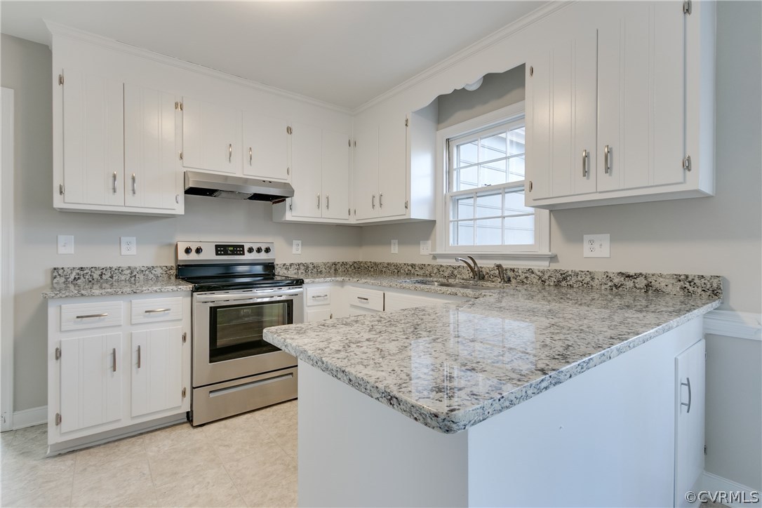 1018 Ashbrook Landing Road Midlothian, VA 23114 - Photo 11 of 46 a kitchen with granite countertop a sink dishwasher a stove and cabinets