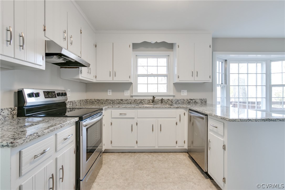1018 Ashbrook Landing Road Midlothian, VA 23114 - Photo 12 of 46 a kitchen with granite countertop cabinets stainless steel appliances and a window