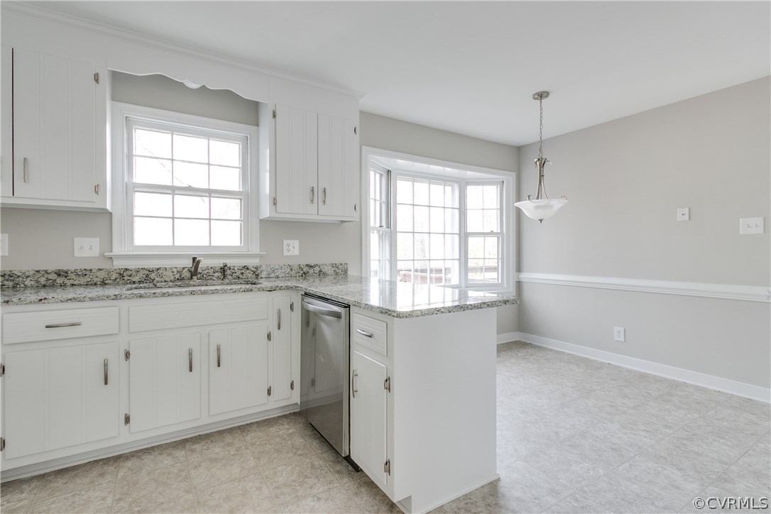 1018 Ashbrook Landing Road Midlothian, VA 23114 - Photo 13 of 46 a kitchen with granite countertop white cabinets and a window