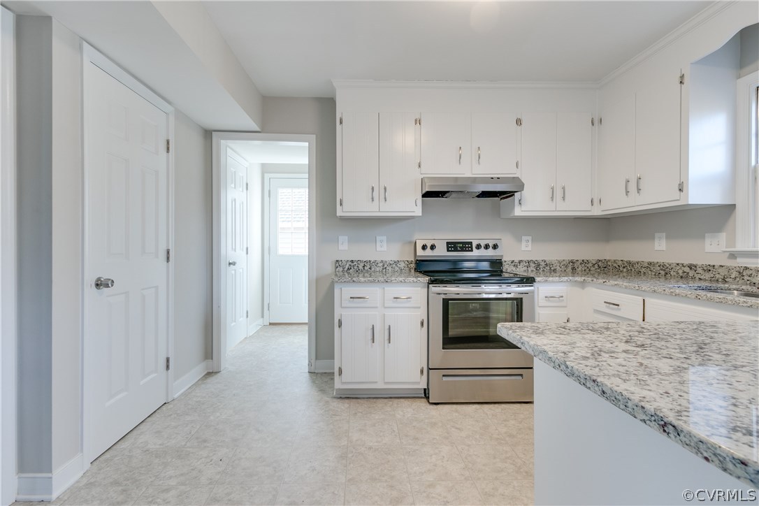 1018 Ashbrook Landing Road Midlothian, VA 23114 - Photo 18 of 46 a white stove top oven and cabinets