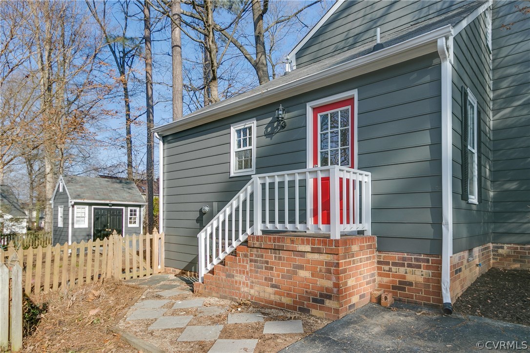 1018 Ashbrook Landing Road Midlothian, VA 23114 - Photo 22 of 46 a view of a house with a small wooden stairs and a large tree