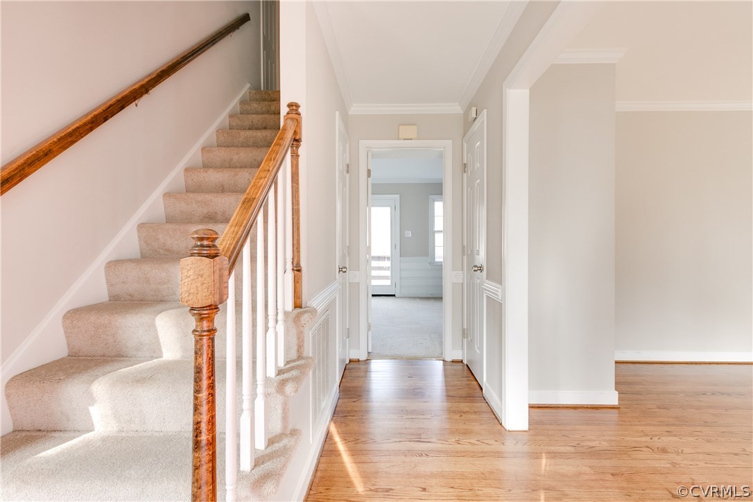 1018 Ashbrook Landing Road Midlothian, VA 23114 - Photo 3 of 46 a view of a hallway with wooden floor and staircase