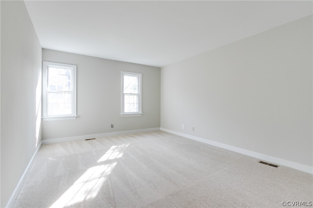 1018 Ashbrook Landing Road Midlothian, VA 23114 - Photo 32 of 46 an empty room with windows
