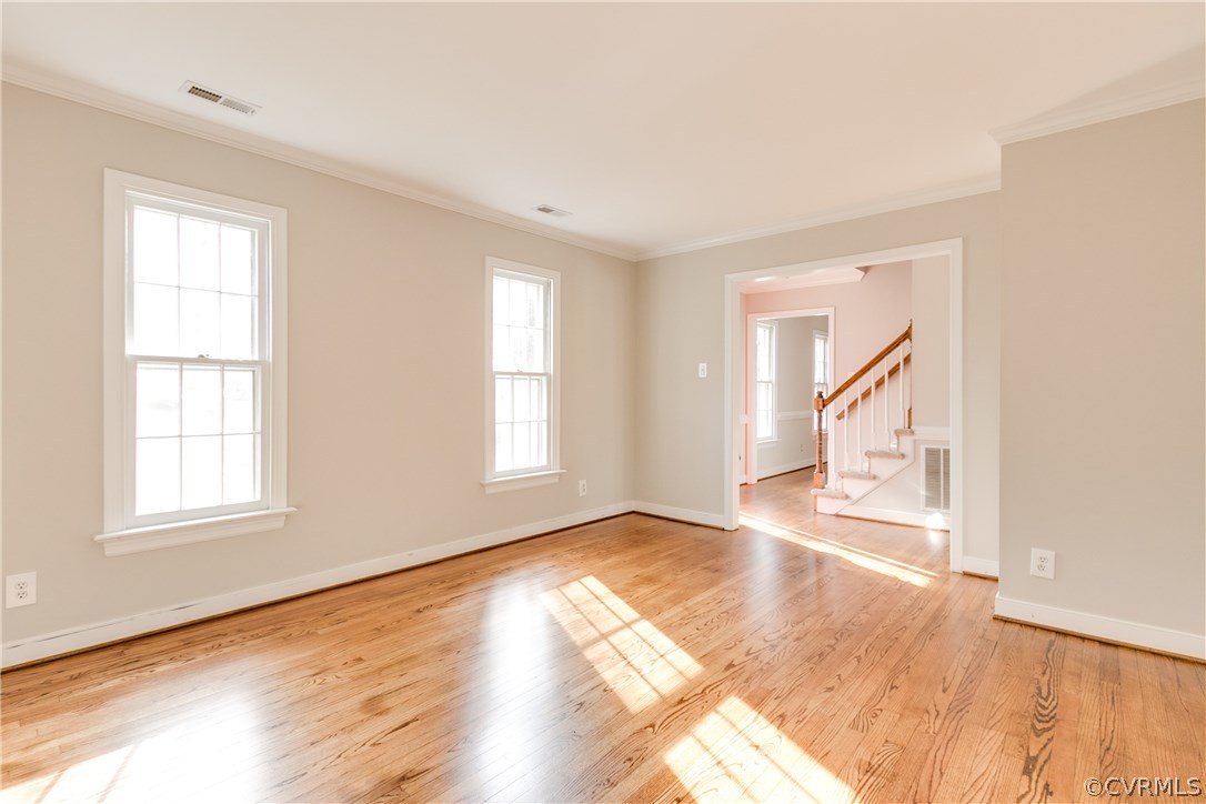 1018 Ashbrook Landing Road Midlothian, VA 23114 - Photo 4 of 46 an empty room with wooden floor and windows