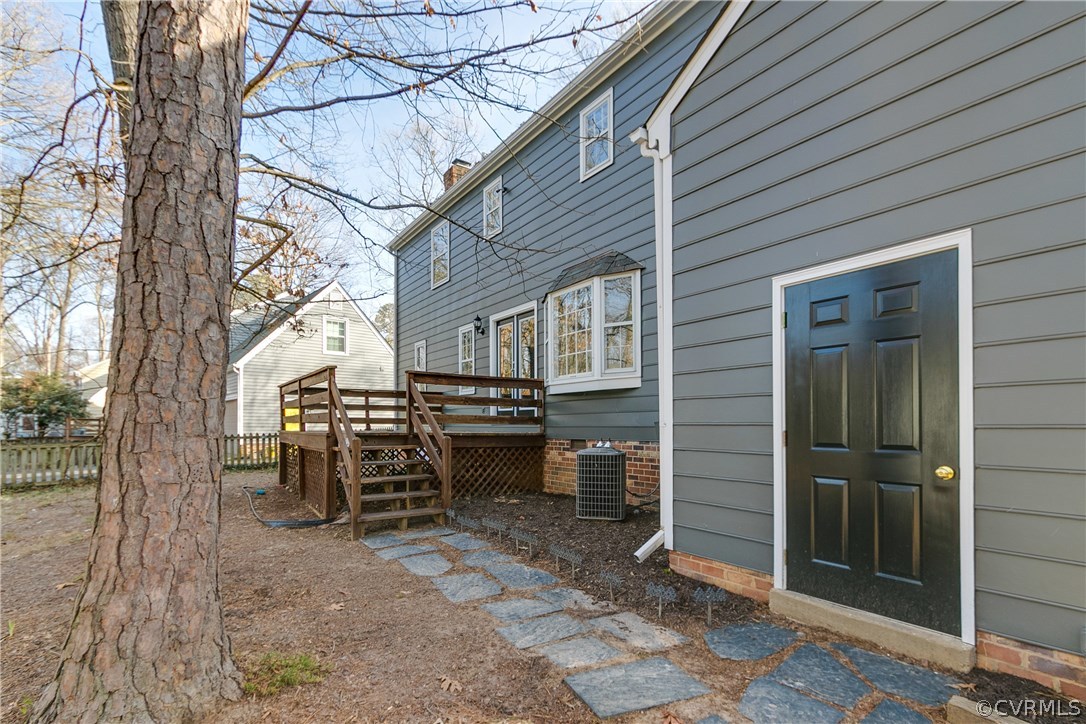 1018 Ashbrook Landing Road Midlothian, VA 23114 - Photo 41 of 46 a view of a patio with table and chairs and a large tree