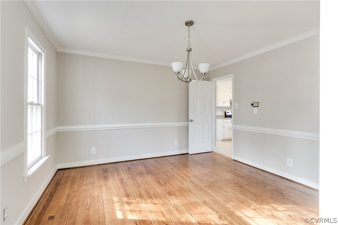 1018 Ashbrook Landing Road Midlothian, VA 23114 - Photo 5 of 46 a view of empty room with wooden floor and window
