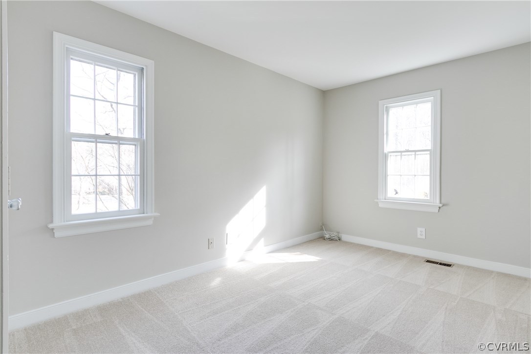 1018 Ashbrook Landing Road Midlothian, VA 23114 - Photo 8 of 46 an empty room with windows