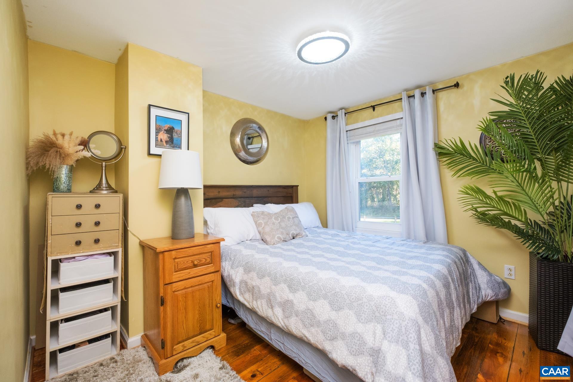 4601 Loving Road North Garden, VA 22959 - Photo 15 of 33 a bedroom with a bed and a window