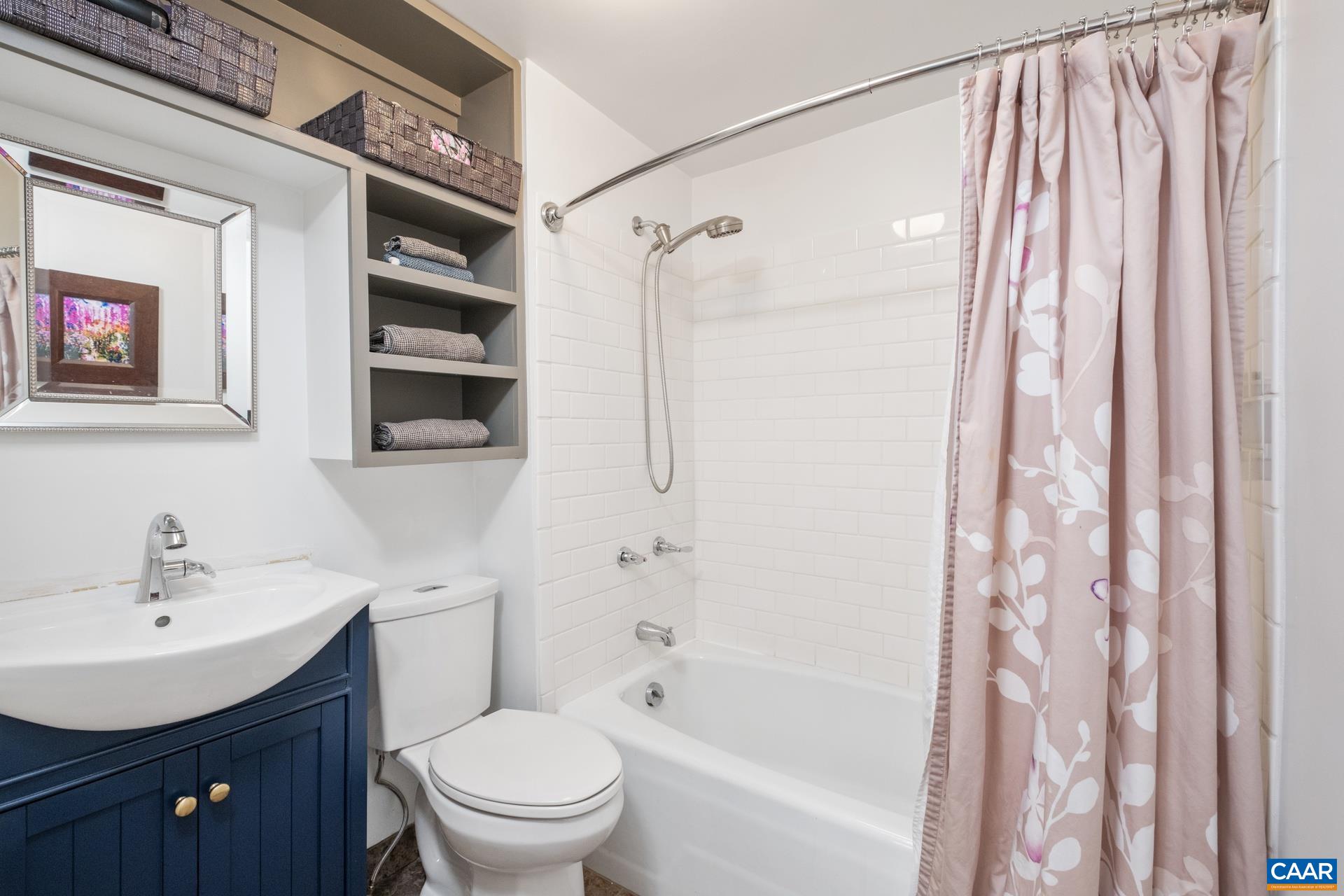4601 Loving Road North Garden, VA 22959 - Photo 16 of 33 a bathroom with a sink a toilet and shower