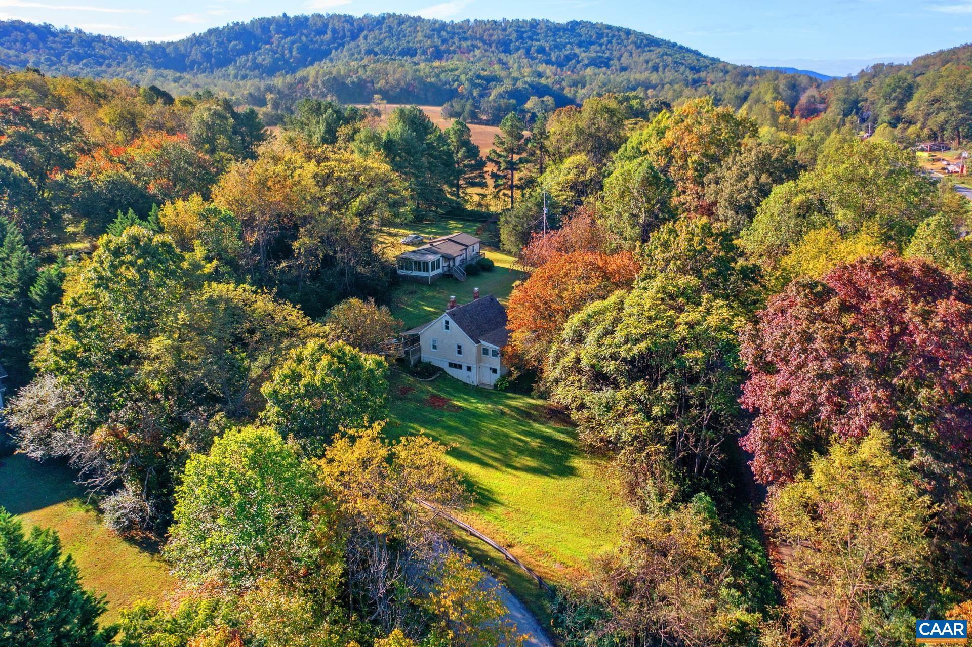 4601 Loving Road North Garden, VA 22959 - Photo 24 of 33 a view of a houses with a lush green hillside