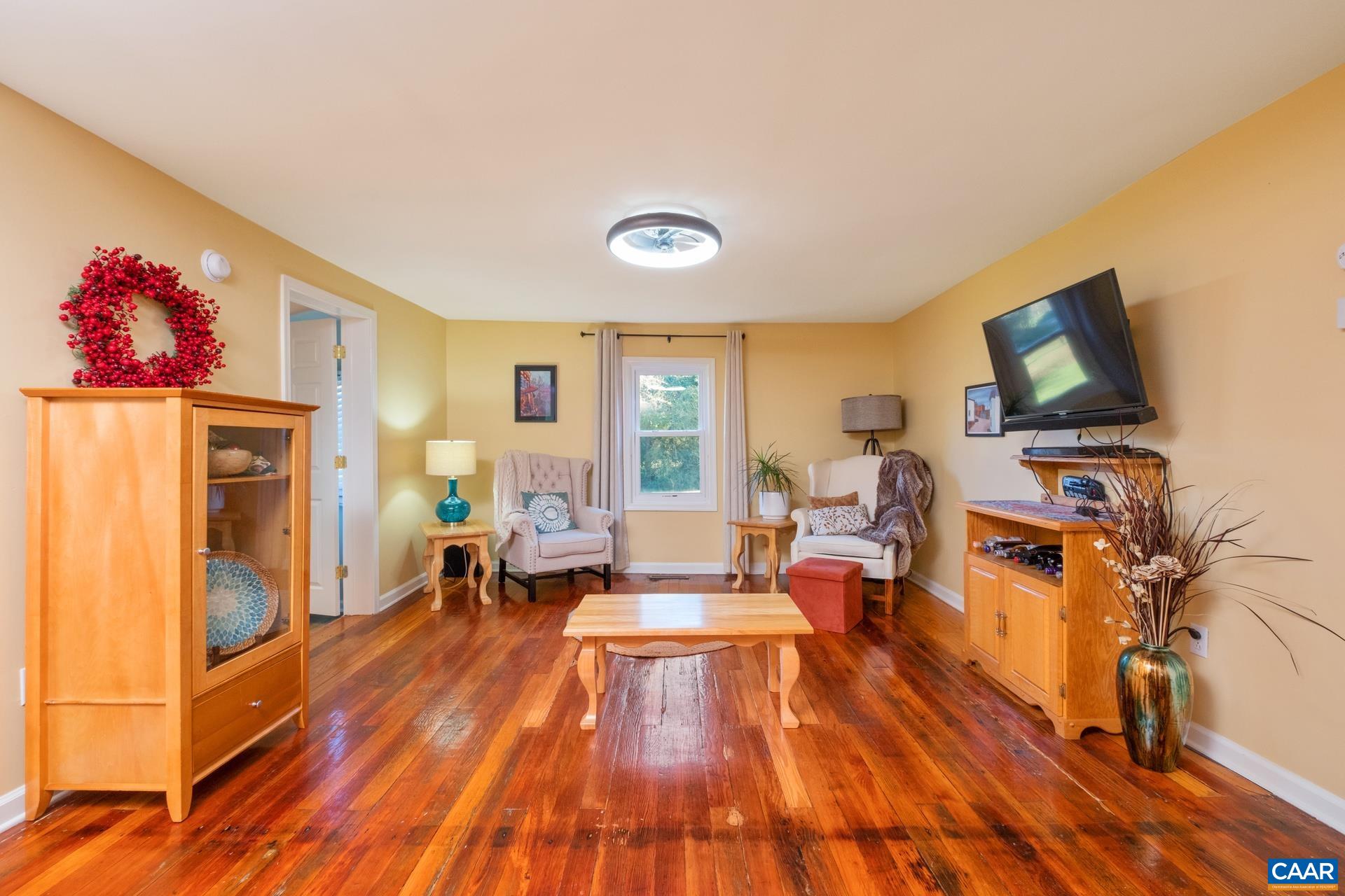 4601 Loving Road North Garden, VA 22959 - Photo 3 of 33 a living room with furniture and a flat screen tv