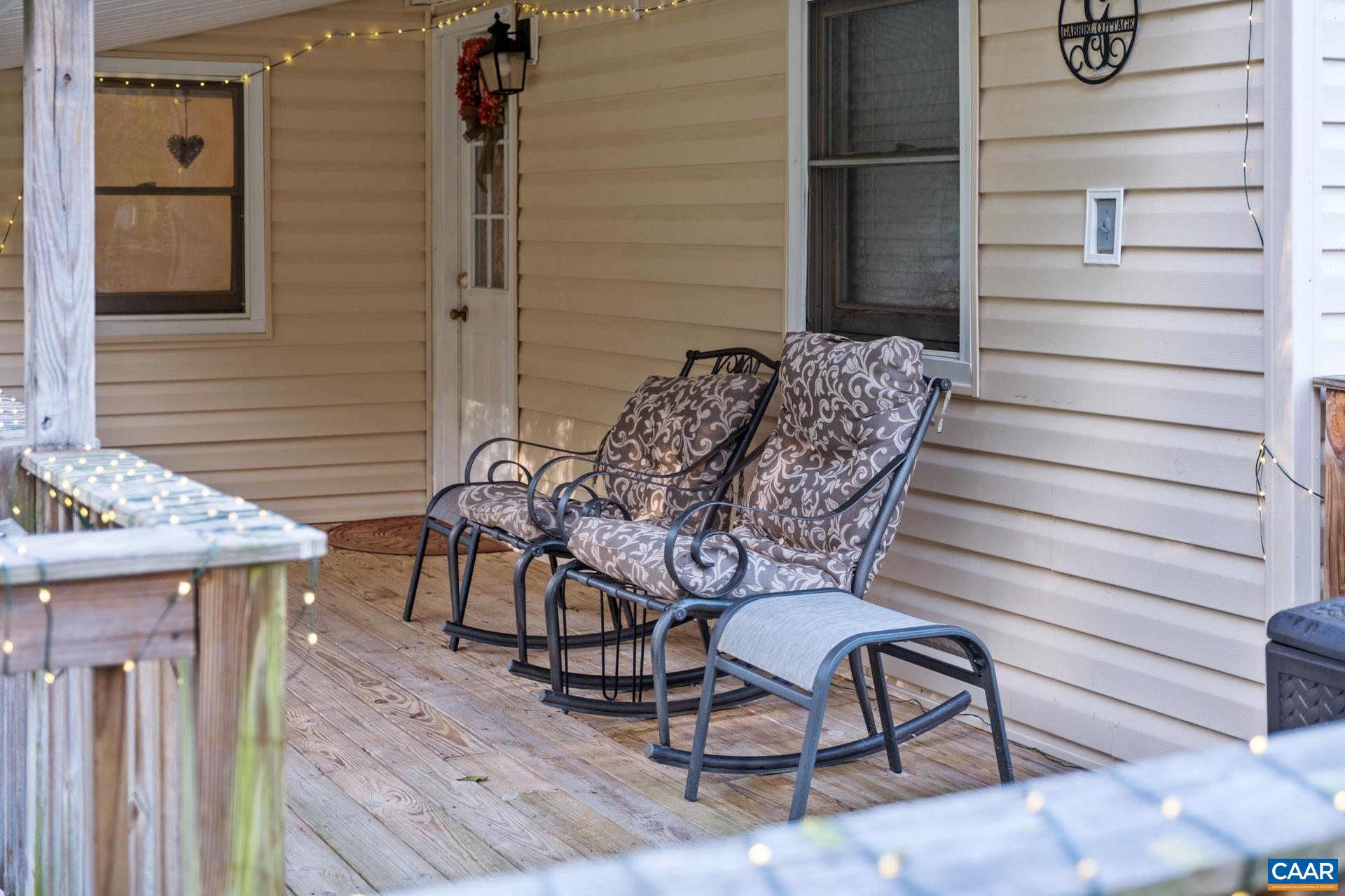 4601 Loving Road North Garden, VA 22959 - Photo 8 of 33 a balcony with table and chairs