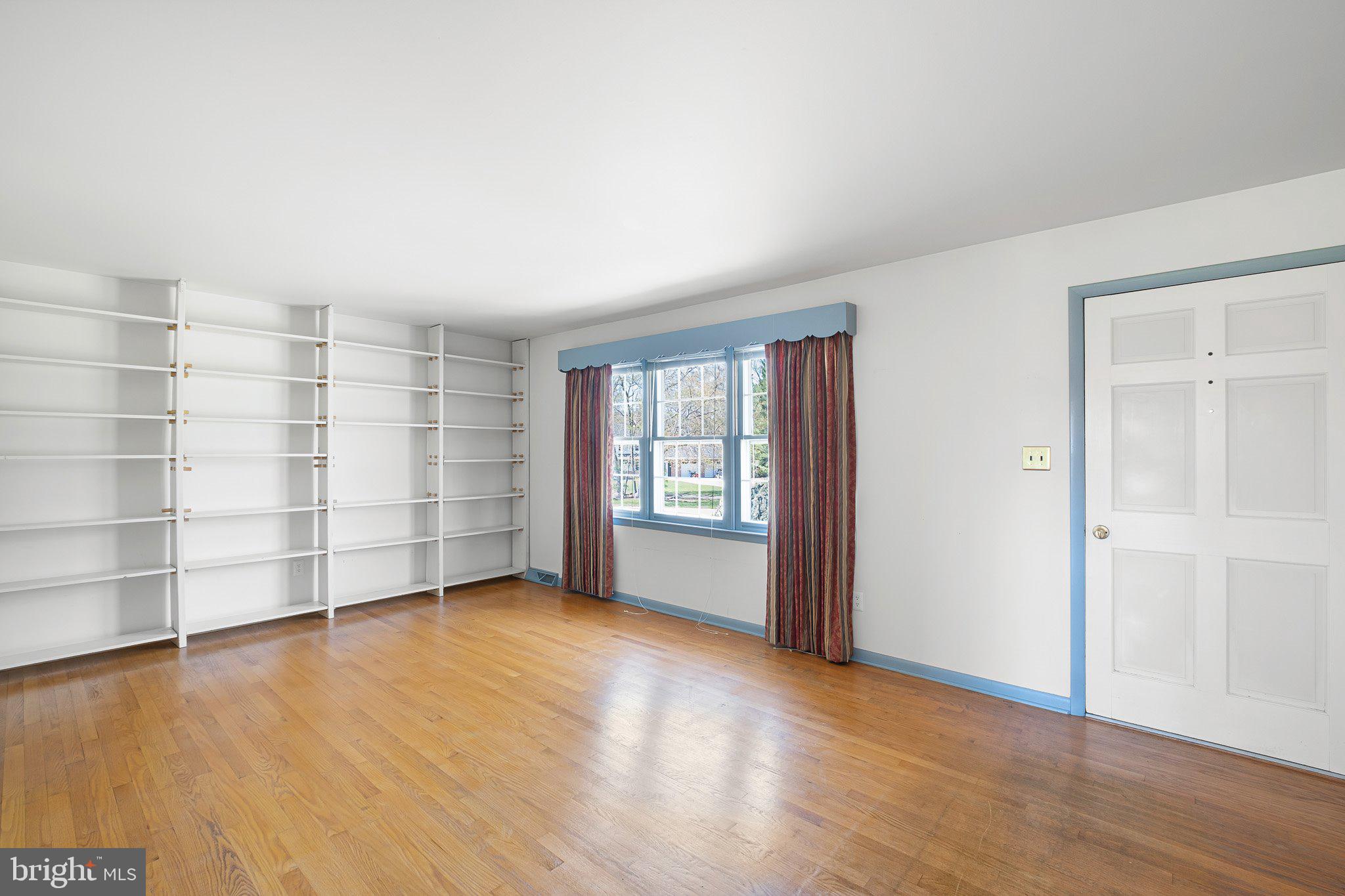 903 Clydesdale Drive Bear, DE 19701 - Photo 7 of 20 wooden floor in an empty room with a window