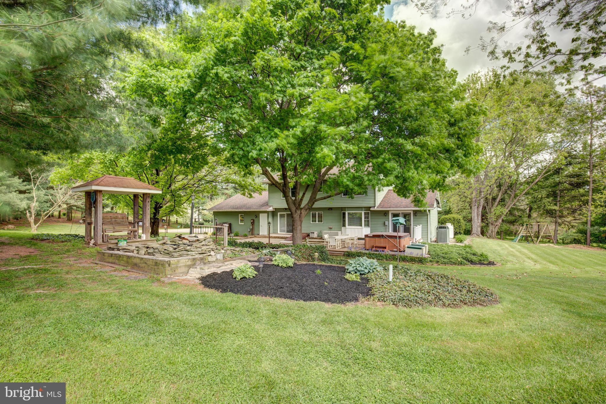 3111 Old Taneytown Road Westminster, MD 21158 - Photo 12 of 62 Back yard has mature water garden & glider/swing