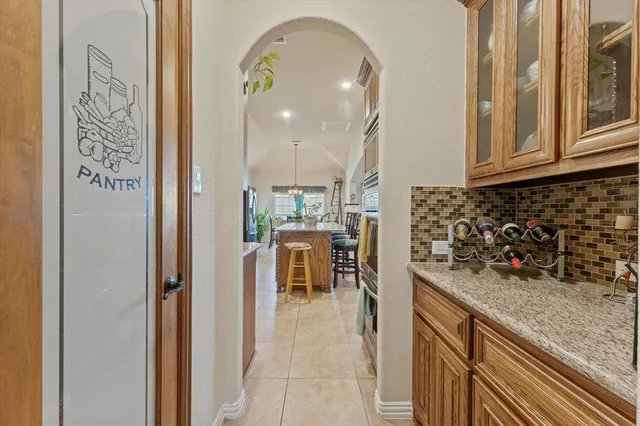 a view of a kitchen with a sink and cabinets