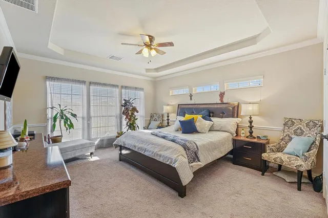 a bed room with a bed window and a table