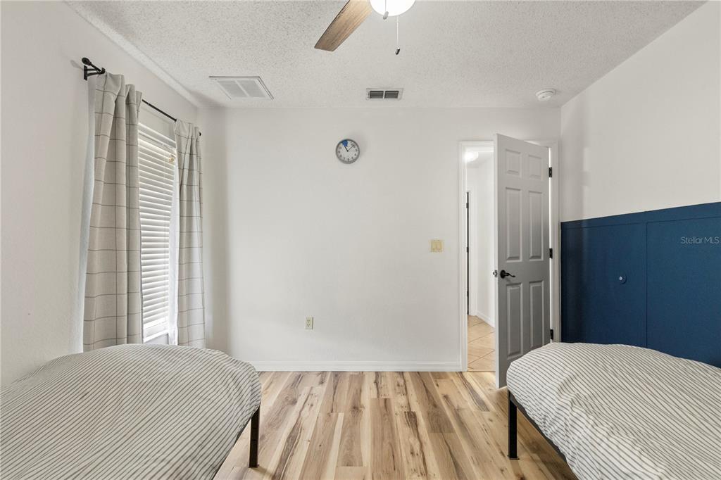 9917 Nelson Road Dade City, FL 33525 - Photo 34 of 40 a bedroom with a bed and a window