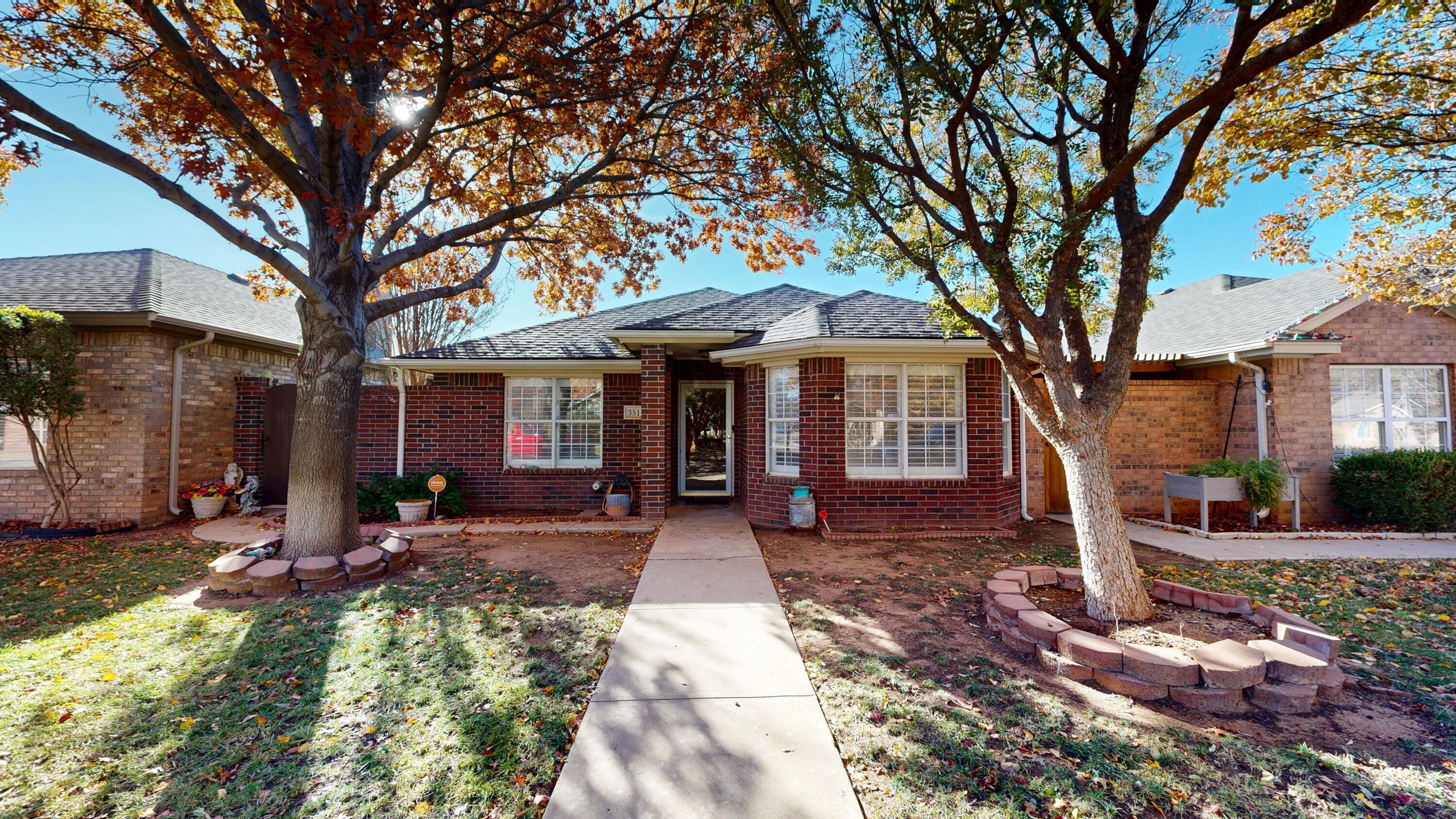 3511 104th Street Lubbock, TX 79423 - Photo 1 of 25 a front view of a house with garden