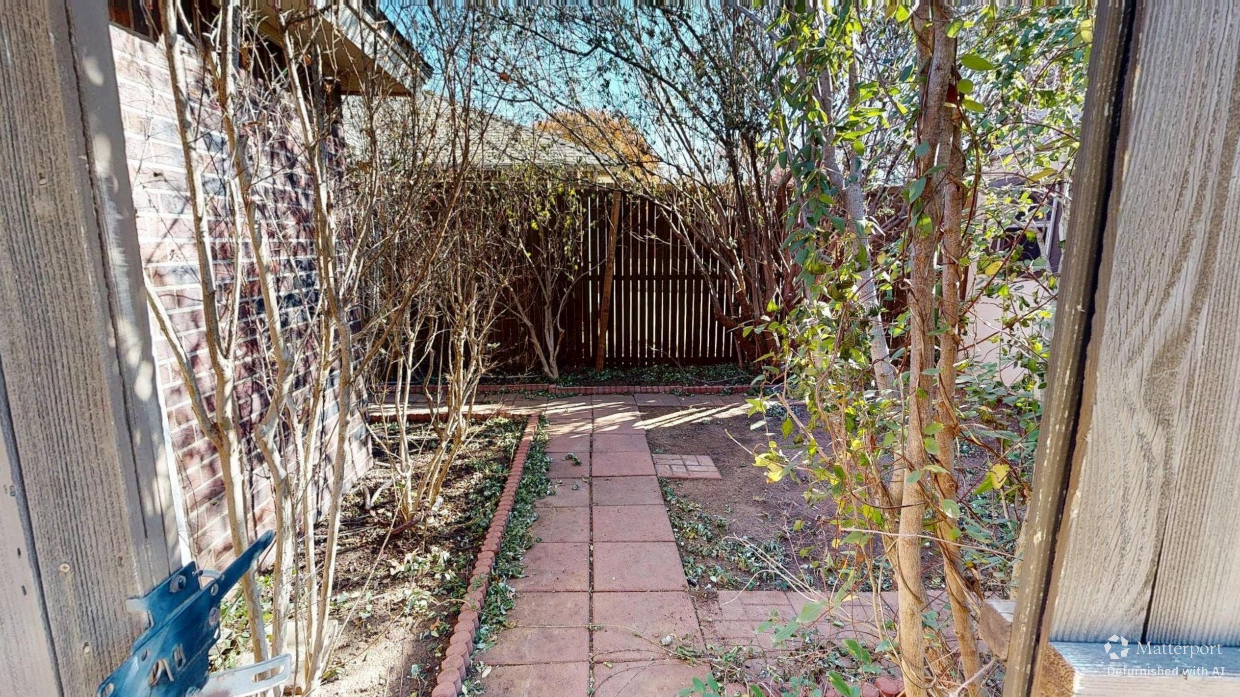 3511 104th Street Lubbock, TX 79423 - Photo 19 of 25 a view of a pathway with a yard