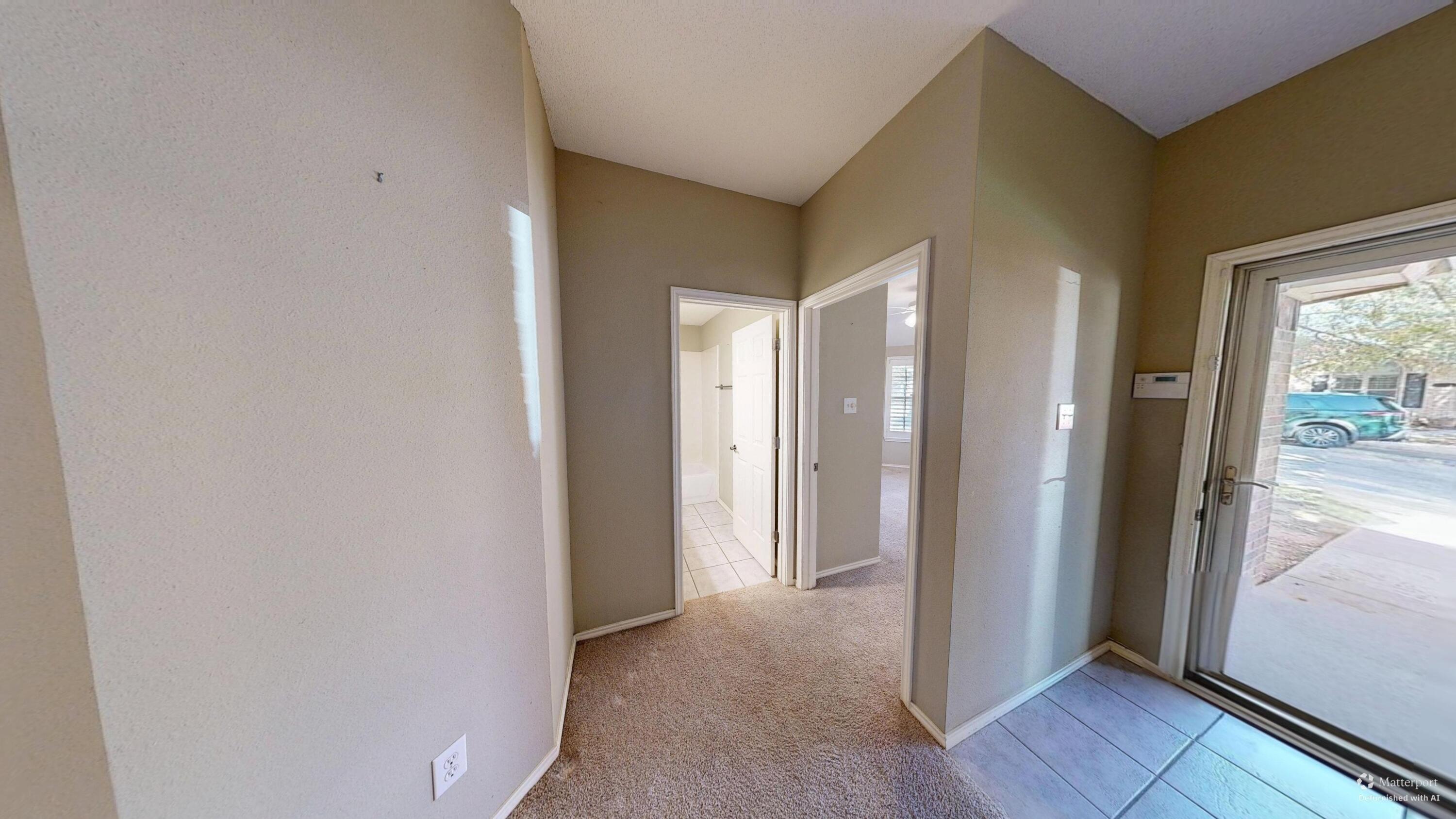 3511 104th Street Lubbock, TX 79423 - Photo 3 of 25 a view of hallway with a large window