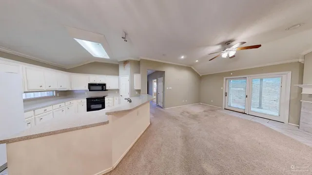 a view of a backyard with large trees