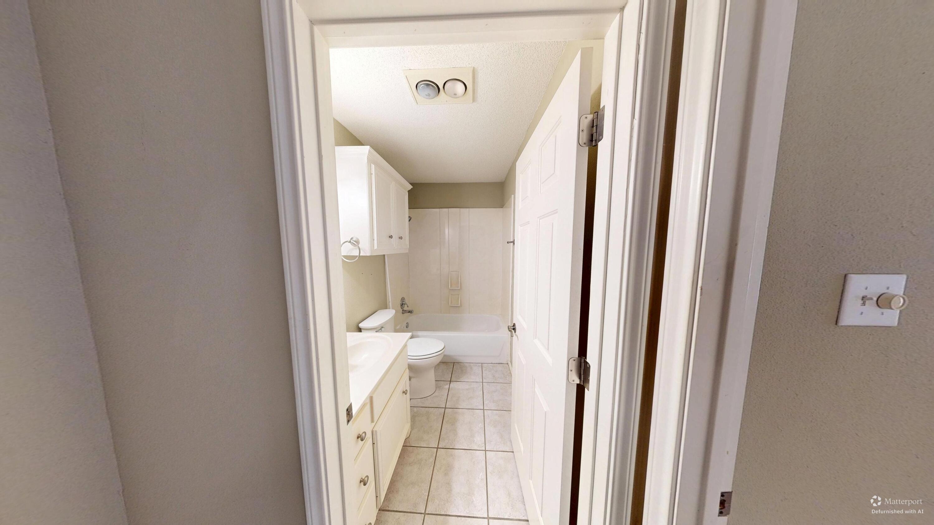 3511 104th Street Lubbock, TX 79423 - Photo 4 of 25 a view of a bathroom from a hallway