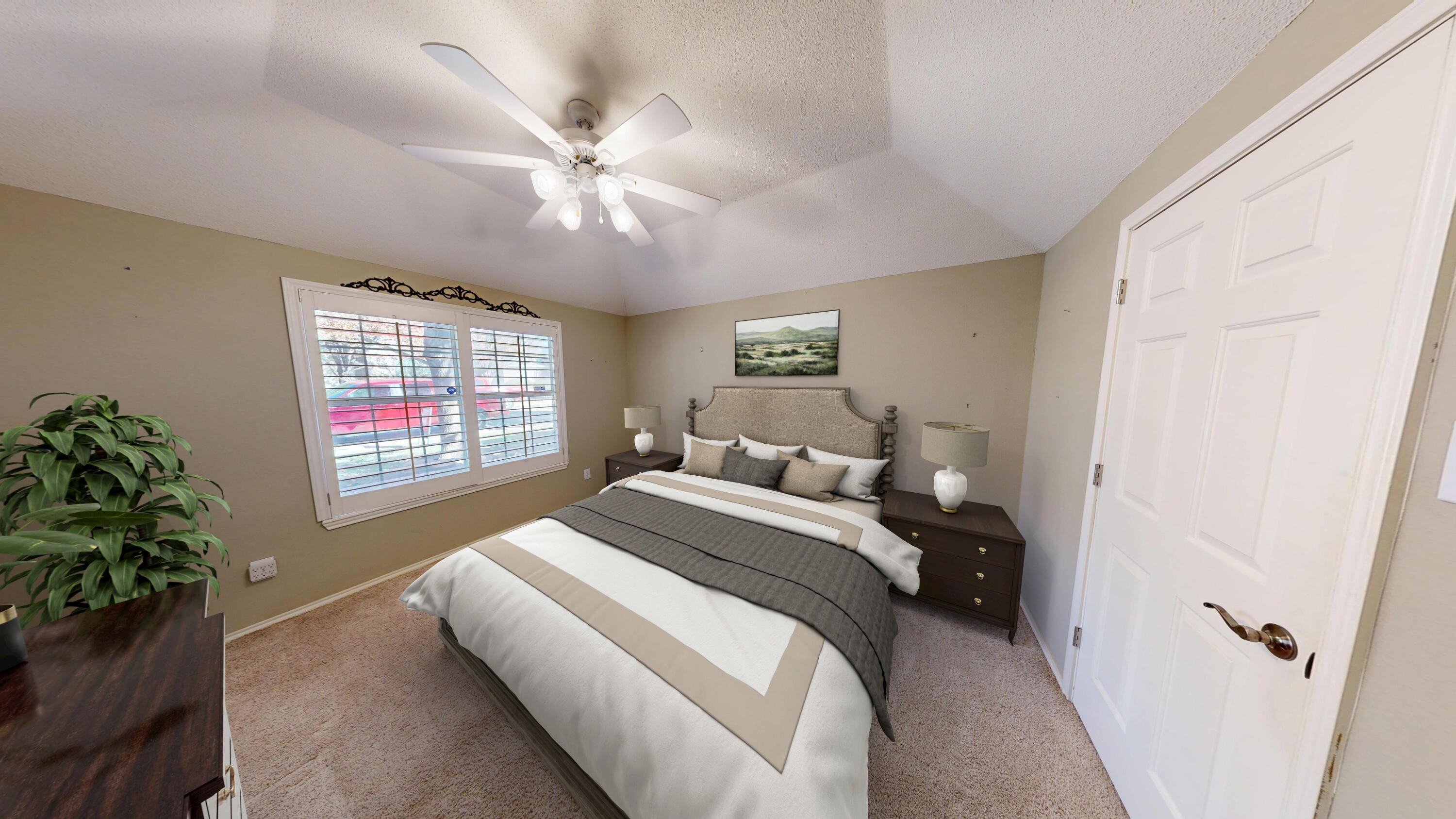 3511 104th Street Lubbock, TX 79423 - Photo 5 of 25 a bed room with a bed window and a chandelier