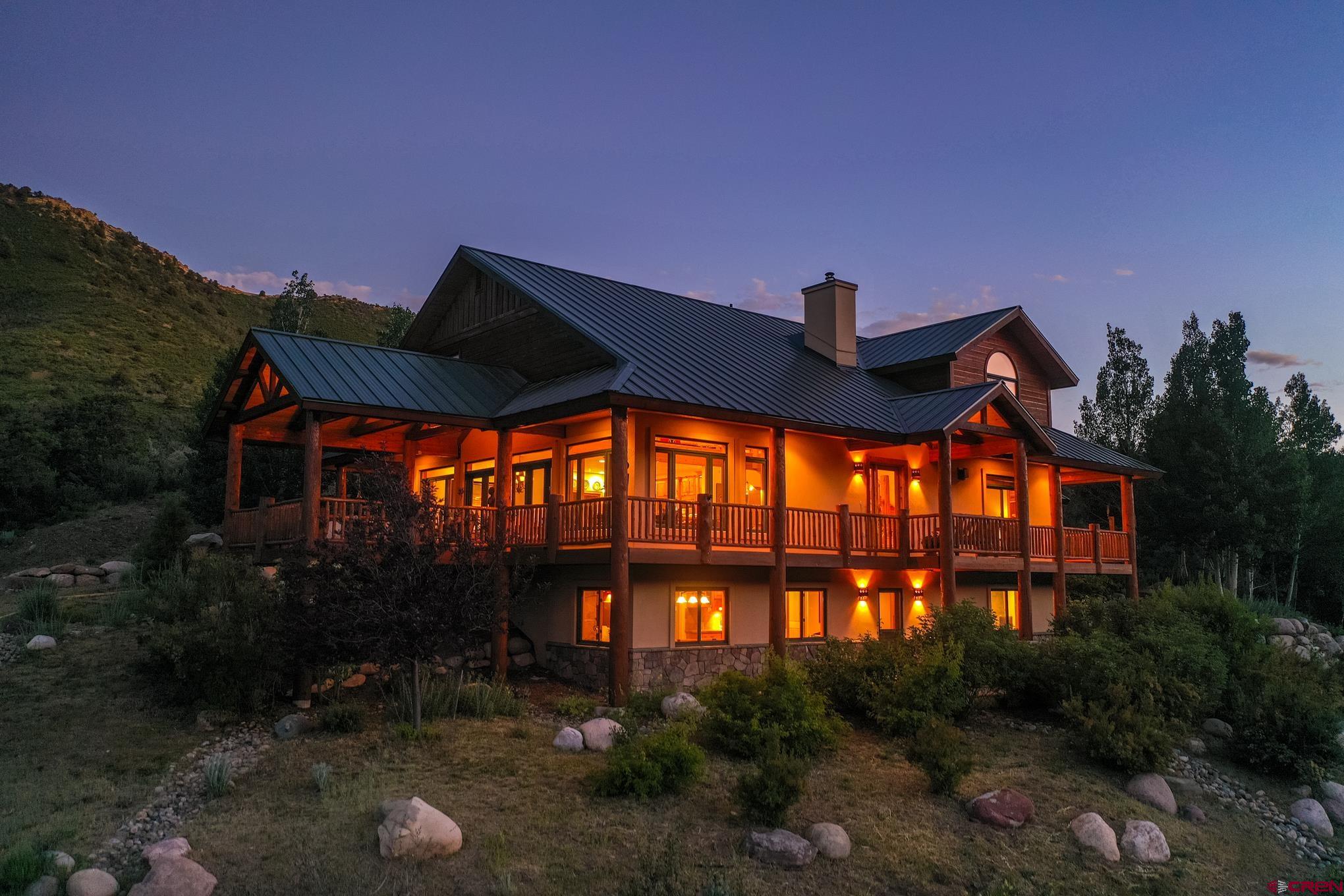 756 Horse Gulch Loop Durango, CO 81301 - Photo 1 of 35 a front view of house along with green space