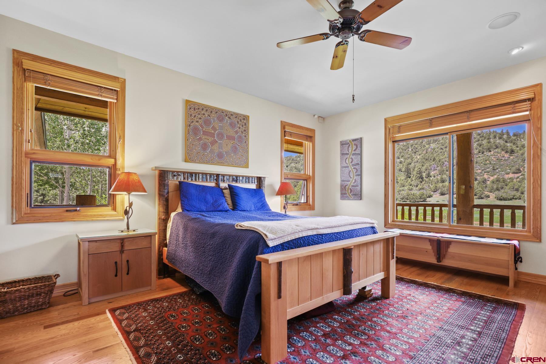 756 Horse Gulch Loop Durango, CO 81301 - Photo 12 of 35 a bedroom with a bed and a window