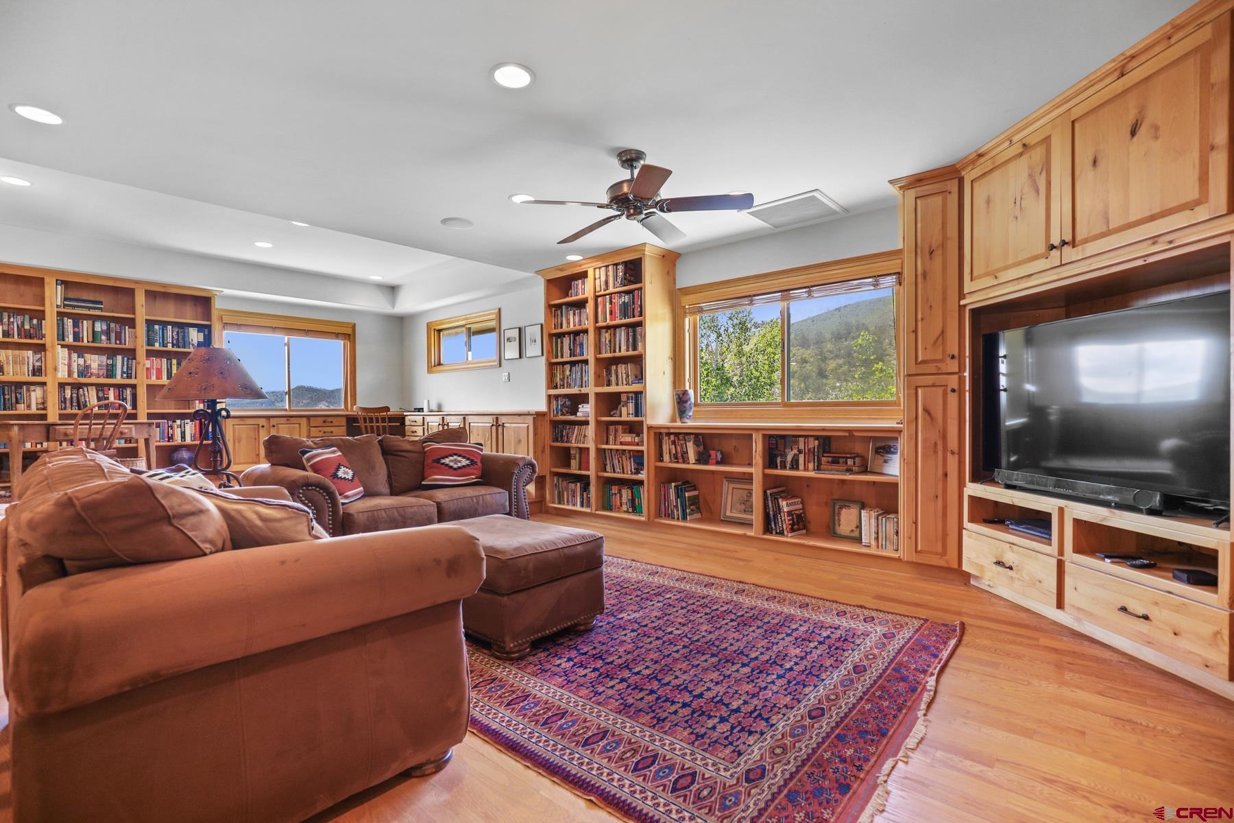 756 Horse Gulch Loop Durango, CO 81301 - Photo 14 of 35 a living room with furniture and a flat screen tv