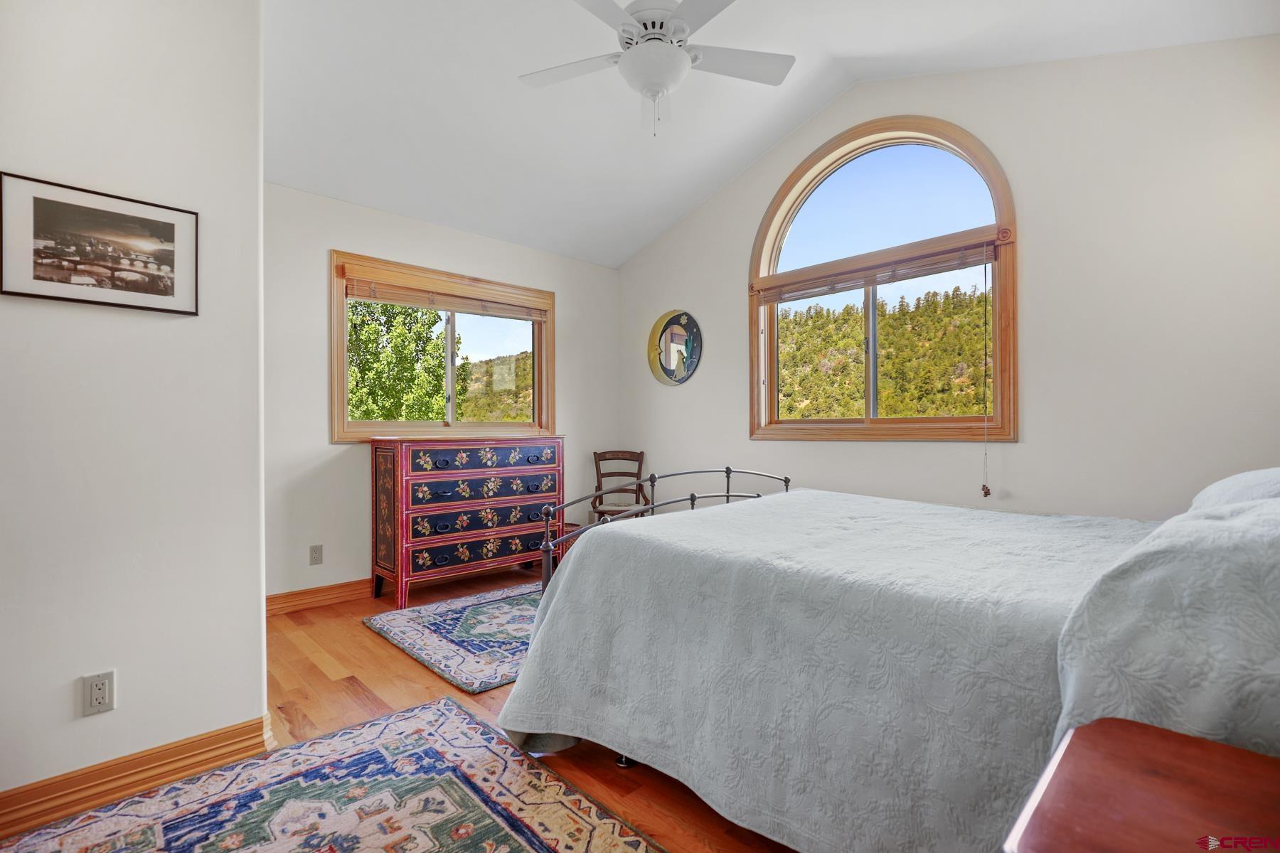 756 Horse Gulch Loop Durango, CO 81301 - Photo 17 of 35 a bedroom with a bed and a window