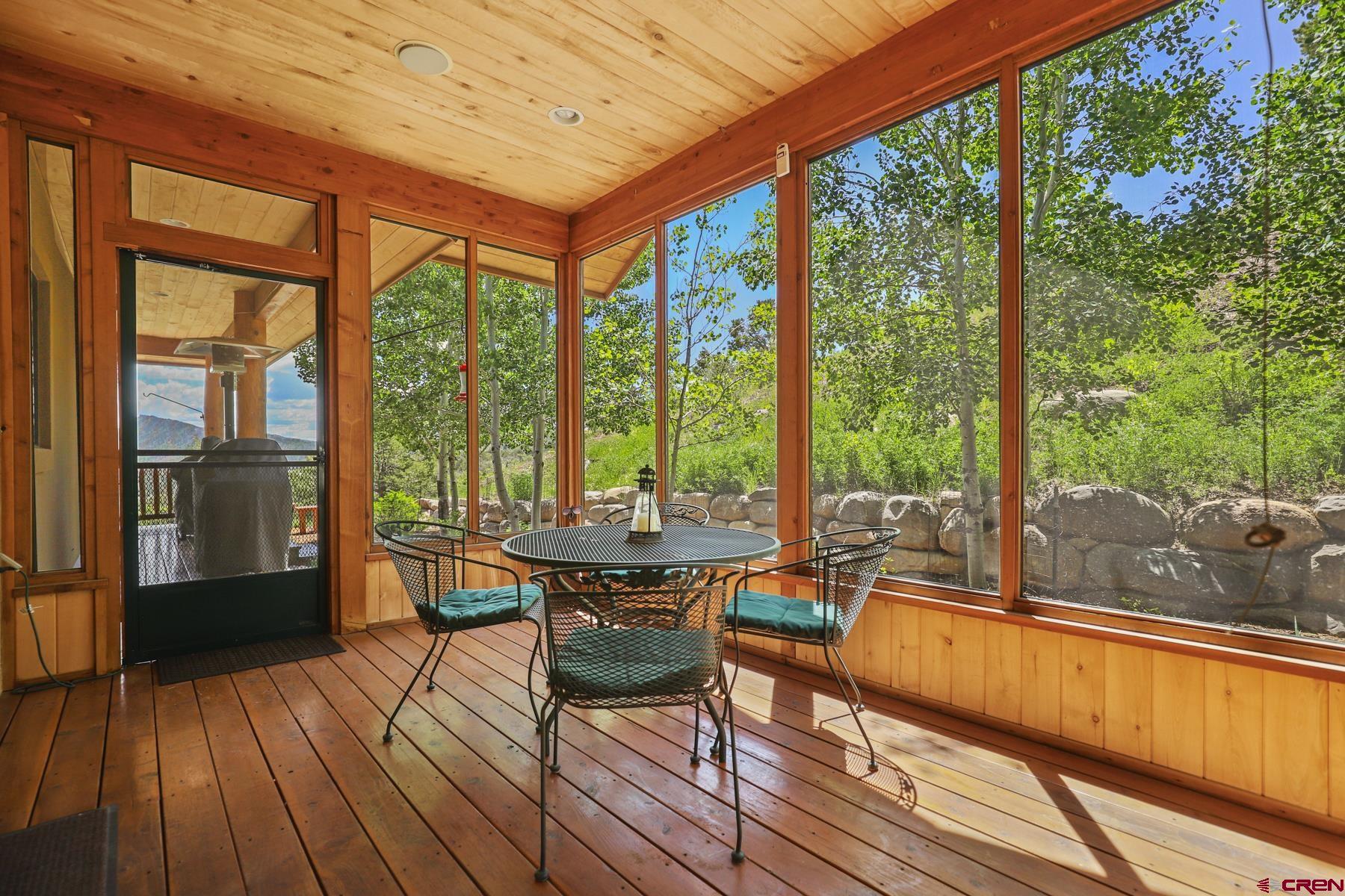 756 Horse Gulch Loop Durango, CO 81301 - Photo 22 of 35 a view of a living room with furniture and wooden floor
