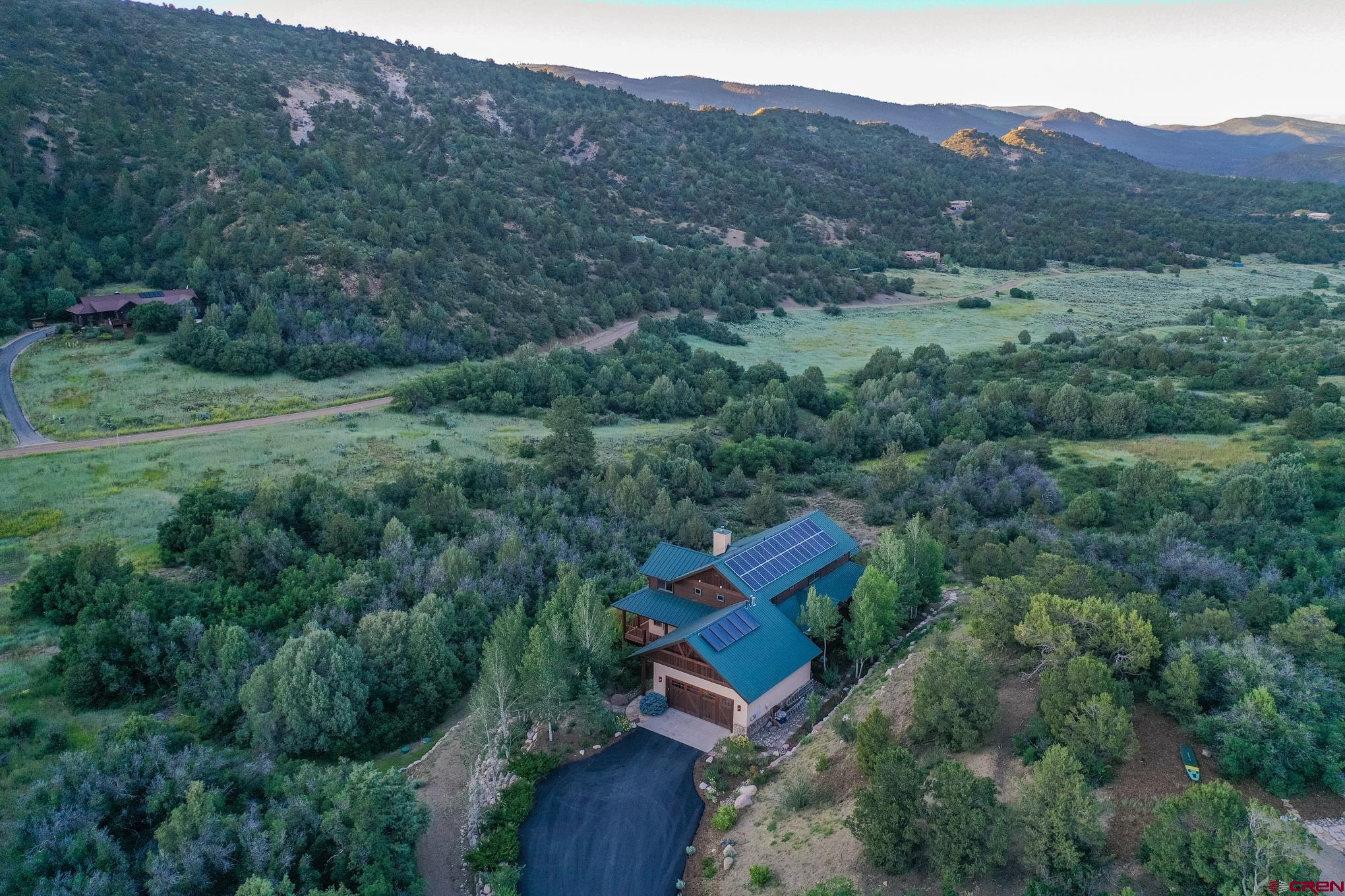 756 Horse Gulch Loop Durango, CO 81301 - Photo 24 of 35 an aerial view of a house with a field