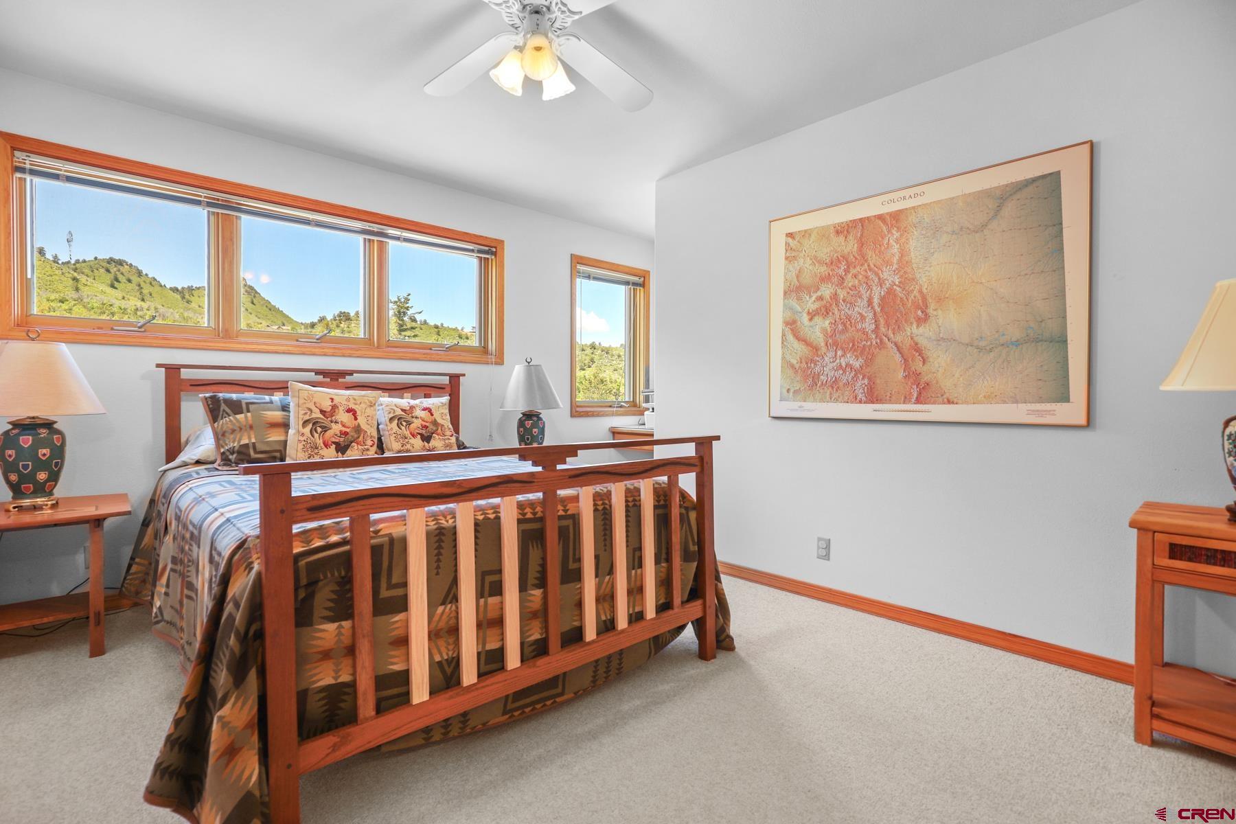 756 Horse Gulch Loop Durango, CO 81301 - Photo 29 of 35 a bedroom with a bed and window