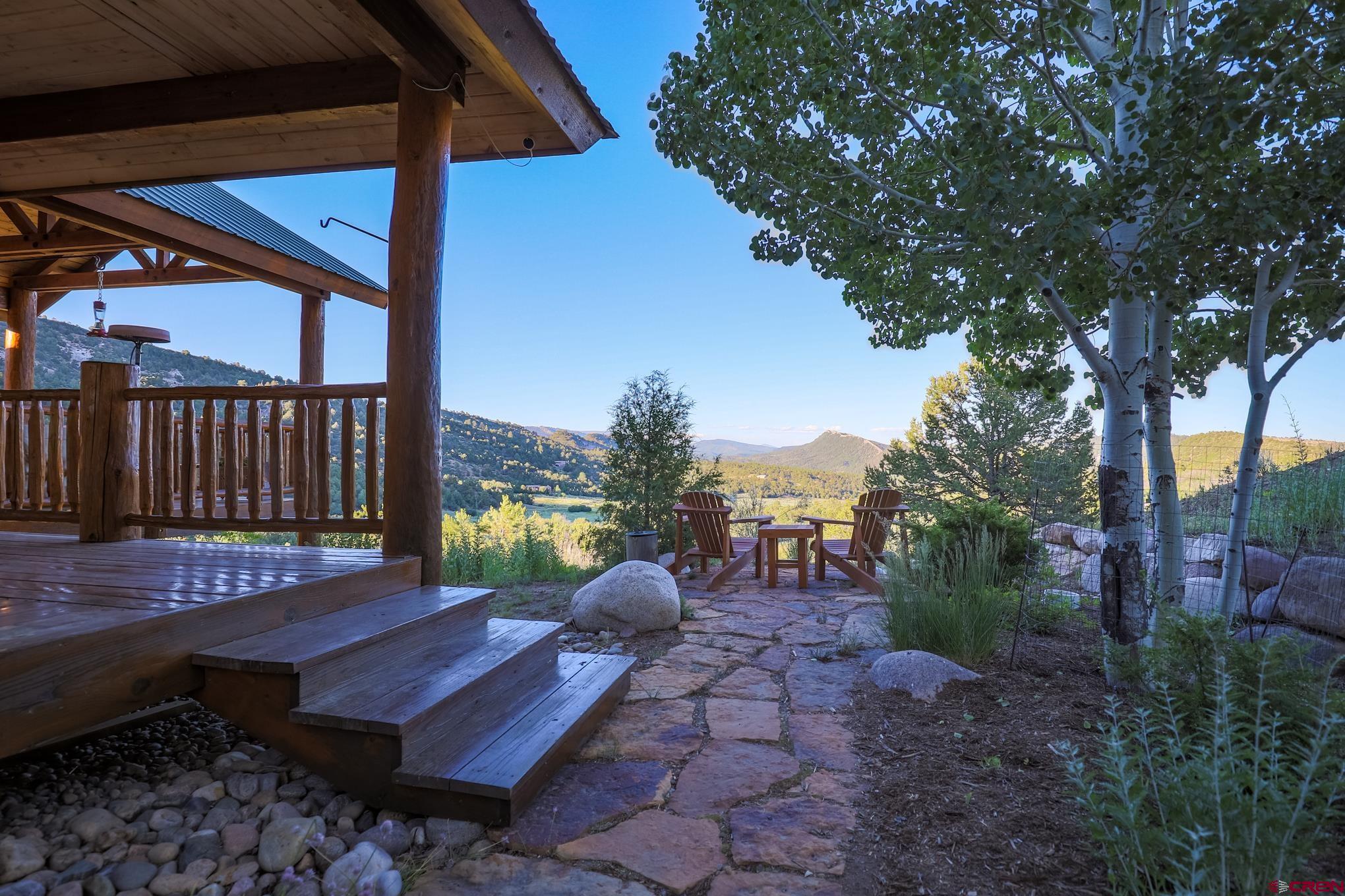756 Horse Gulch Loop Durango, CO 81301 - Photo 3 of 35 a view of a roof deck with wooden floor and fence