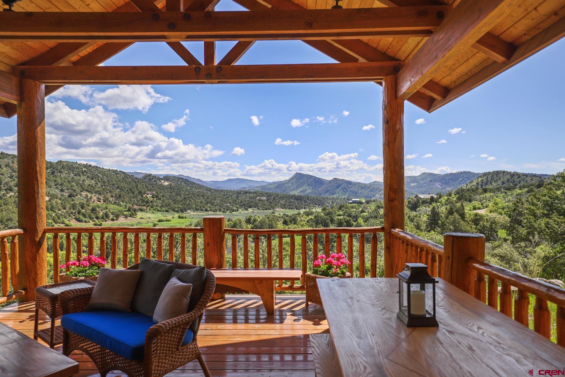 756 Horse Gulch Loop Durango, CO 81301 - Photo 4 of 35 a roof deck with table and chairs