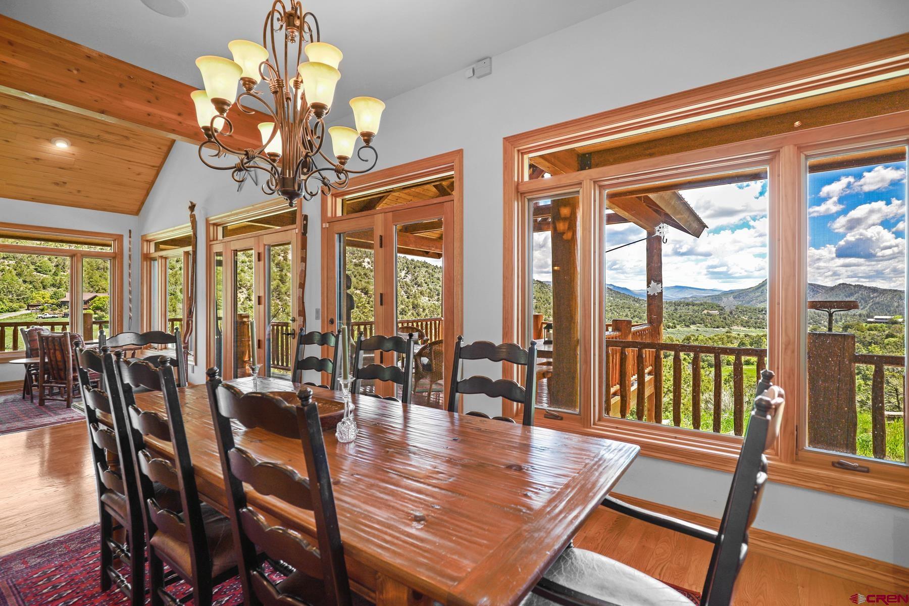 756 Horse Gulch Loop Durango, CO 81301 - Photo 5 of 35 a view of a dining room with furniture window and outside view