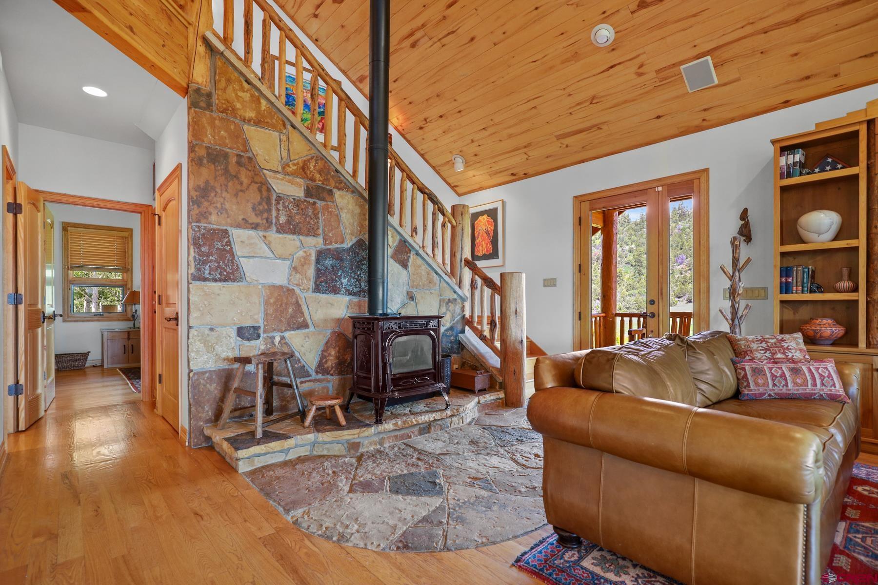 756 Horse Gulch Loop Durango, CO 81301 - Photo 8 of 35 a living room with furniture and floor to ceiling windows