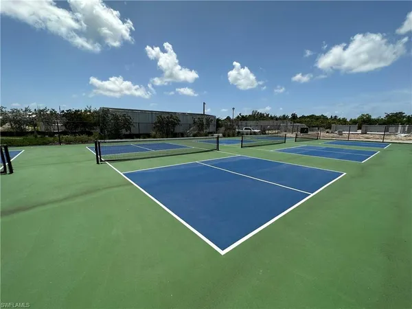 a view of a swimming pool with a yard