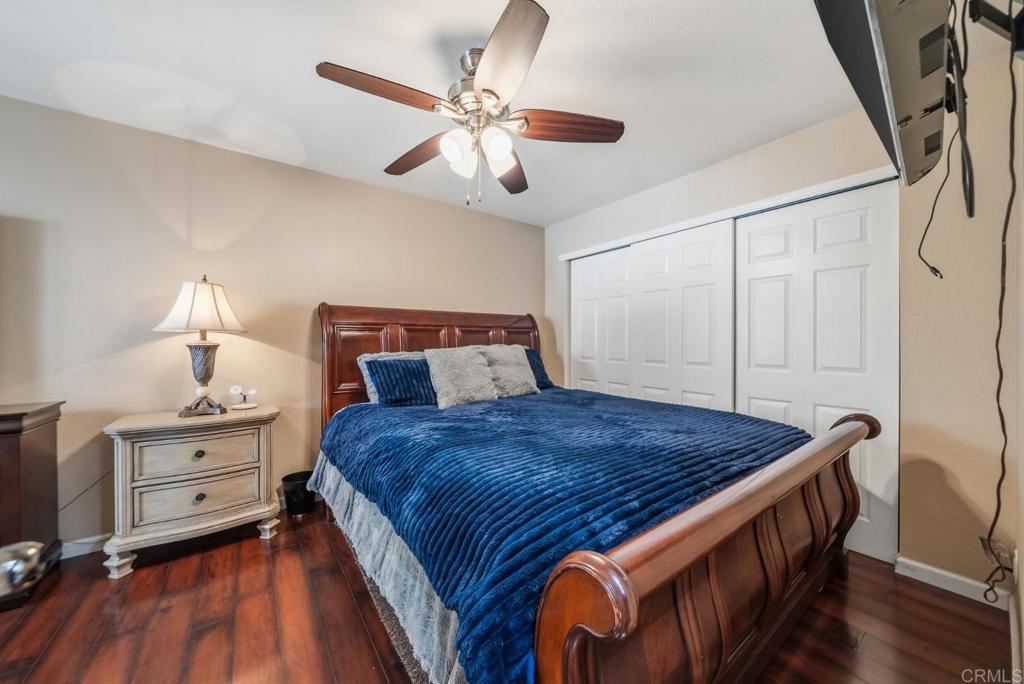 12750 Laurel Street, Unit 510 Lakeside, CA 92040 - Photo 15 of 19 a bedroom with a bed and a chandelier