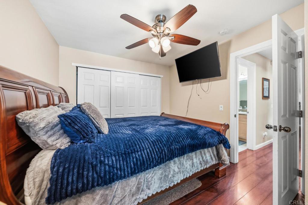 12750 Laurel Street, Unit 510 Lakeside, CA 92040 - Photo 17 of 19 a spacious bedroom with a bed and a flat screen tv