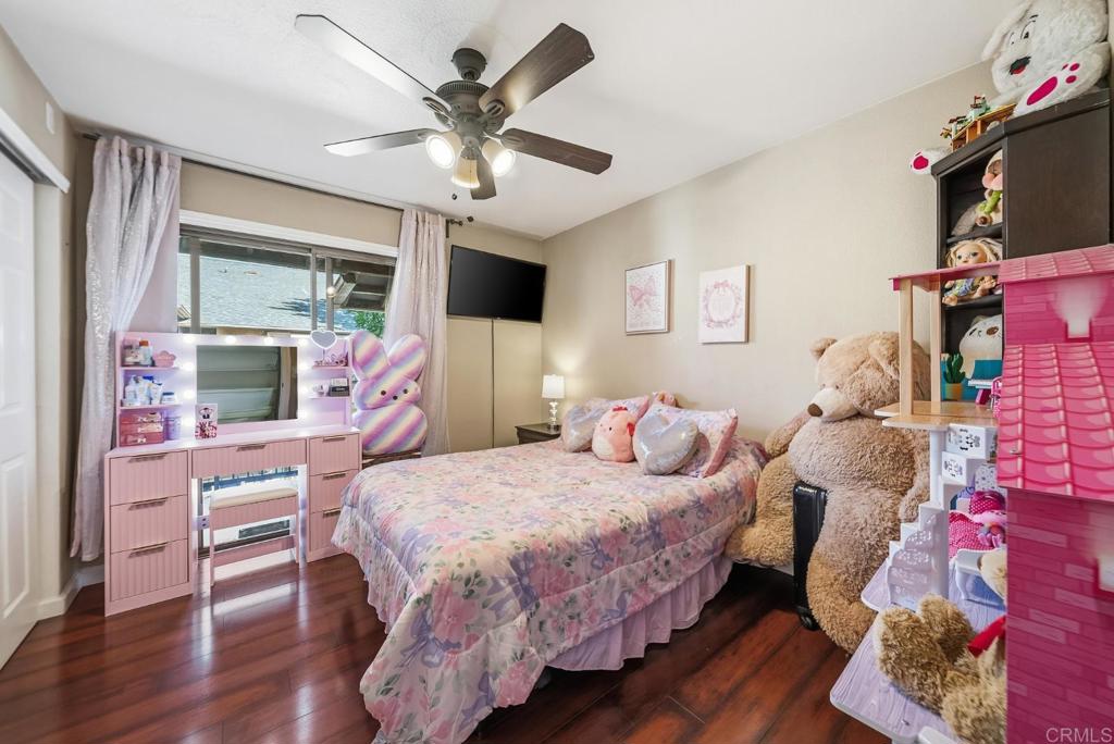 12750 Laurel Street, Unit 510 Lakeside, CA 92040 - Photo 18 of 19 a bedroom with a bed and a flat screen tv