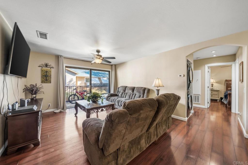 12750 Laurel Street, Unit 510 Lakeside, CA 92040 - Photo 4 of 19 a living room with furniture a flat screen tv and wooden floor