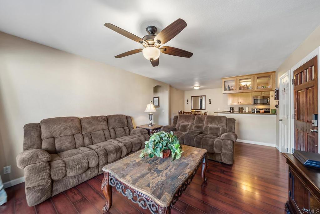12750 Laurel Street, Unit 510 Lakeside, CA 92040 - Photo 6 of 19 a living room with furniture kitchen view and a chandelier