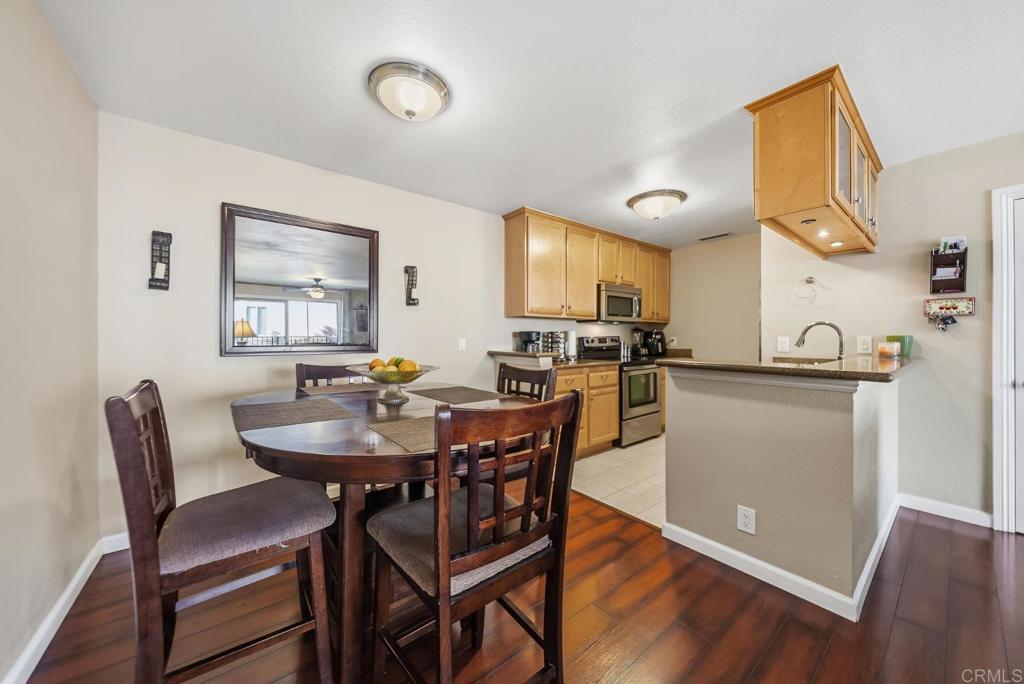 12750 Laurel Street, Unit 510 Lakeside, CA 92040 - Photo 8 of 19 a view of a dining room with furniture and wooden floor
