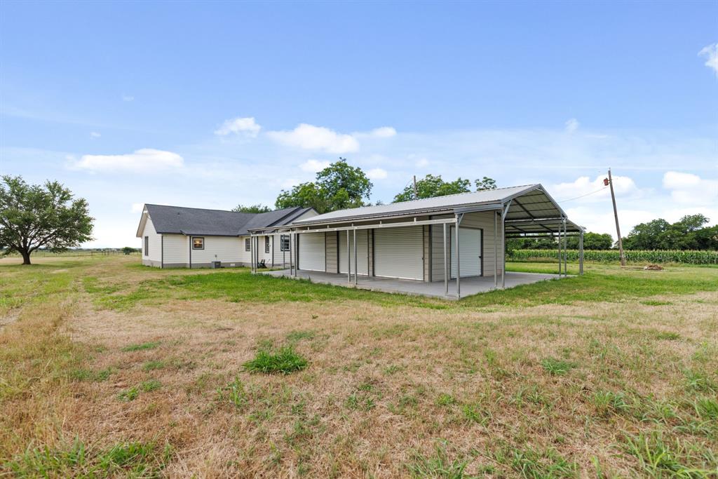 300 Grellhesl Road West, TX 76691 - Photo 24 of 35 a view of a house with backyard and trees