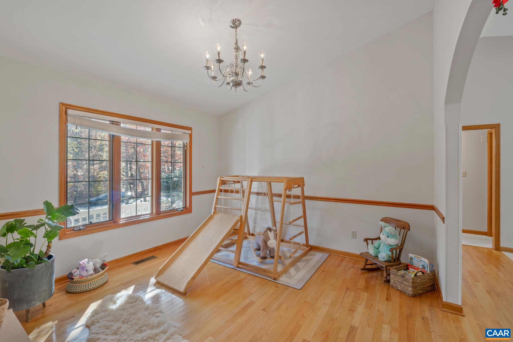 30 Brougham Road Palmyra, VA 22963 - Photo 12 of 57 a view of a room with furniture a chandelier and wooden floor