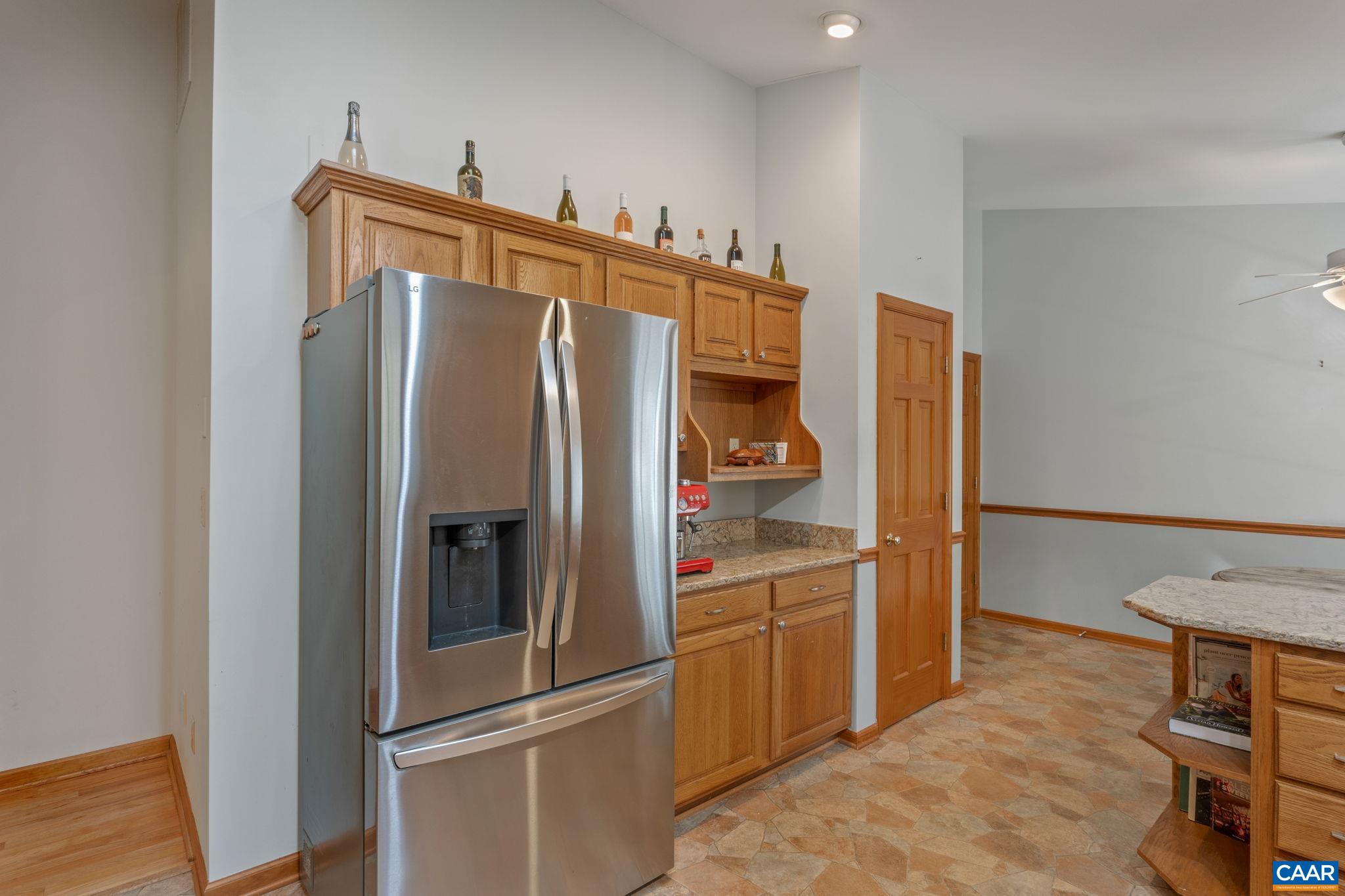 30 Brougham Road Palmyra, VA 22963 - Photo 14 of 57 a kitchen with stainless steel appliances a refrigerator and wooden floor
