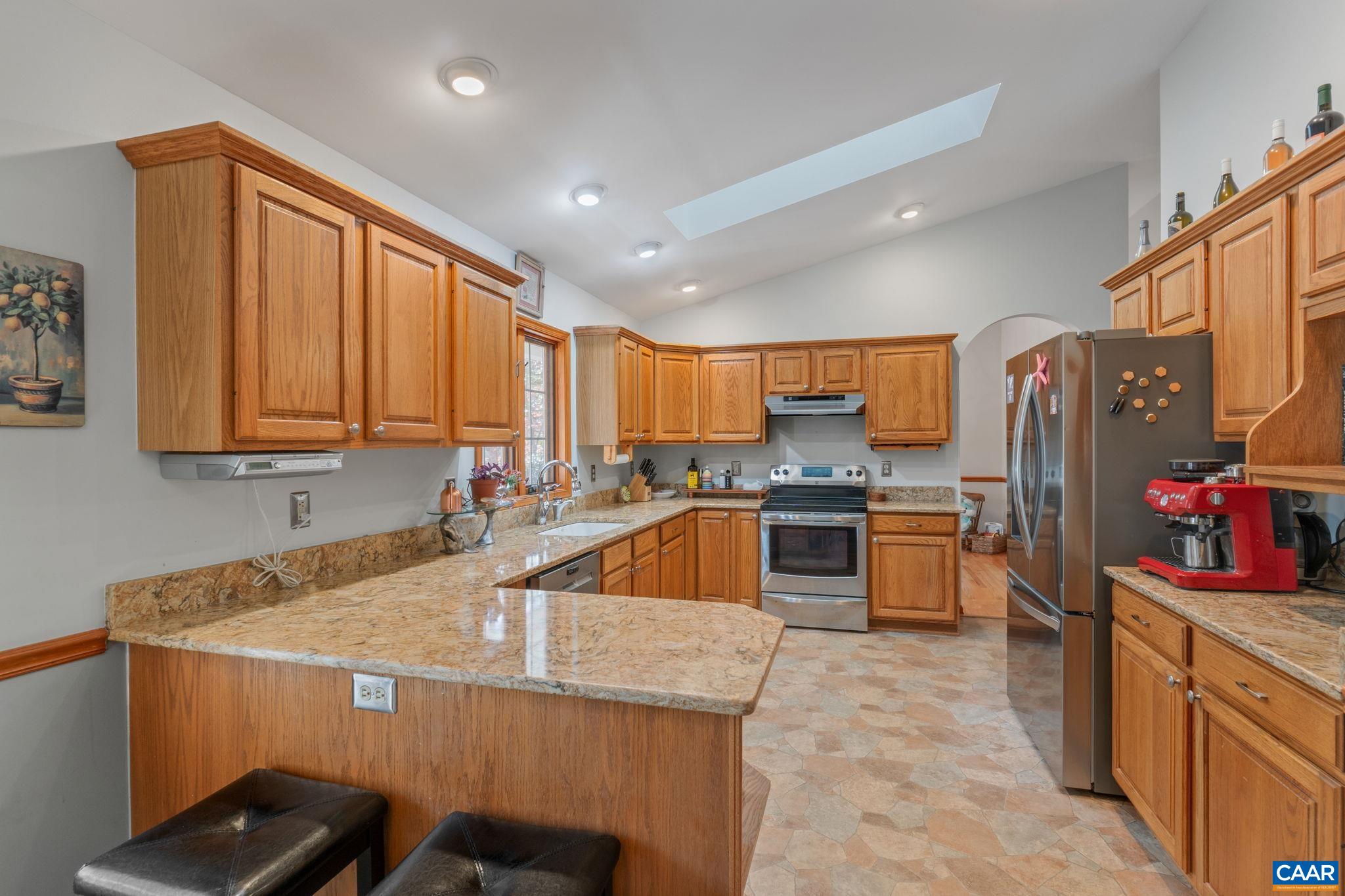 30 Brougham Road Palmyra, VA 22963 - Photo 18 of 57 a kitchen with stainless steel appliances kitchen island granite countertop a sink counter space and stainless steel appliances