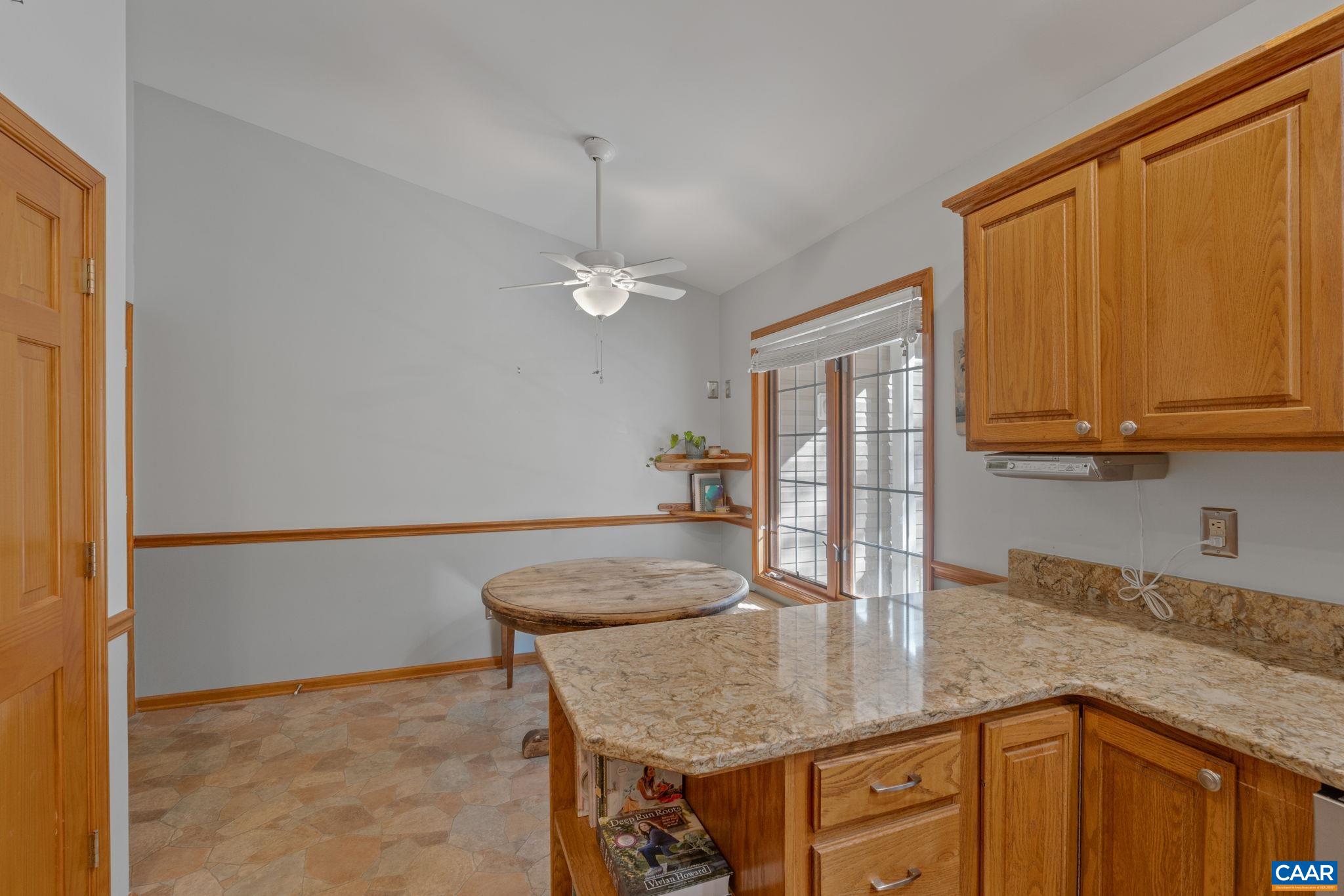 30 Brougham Road Palmyra, VA 22963 - Photo 19 of 57 a kitchen with stainless steel appliances granite countertop a sink dishwasher and cabinets with wooden floor